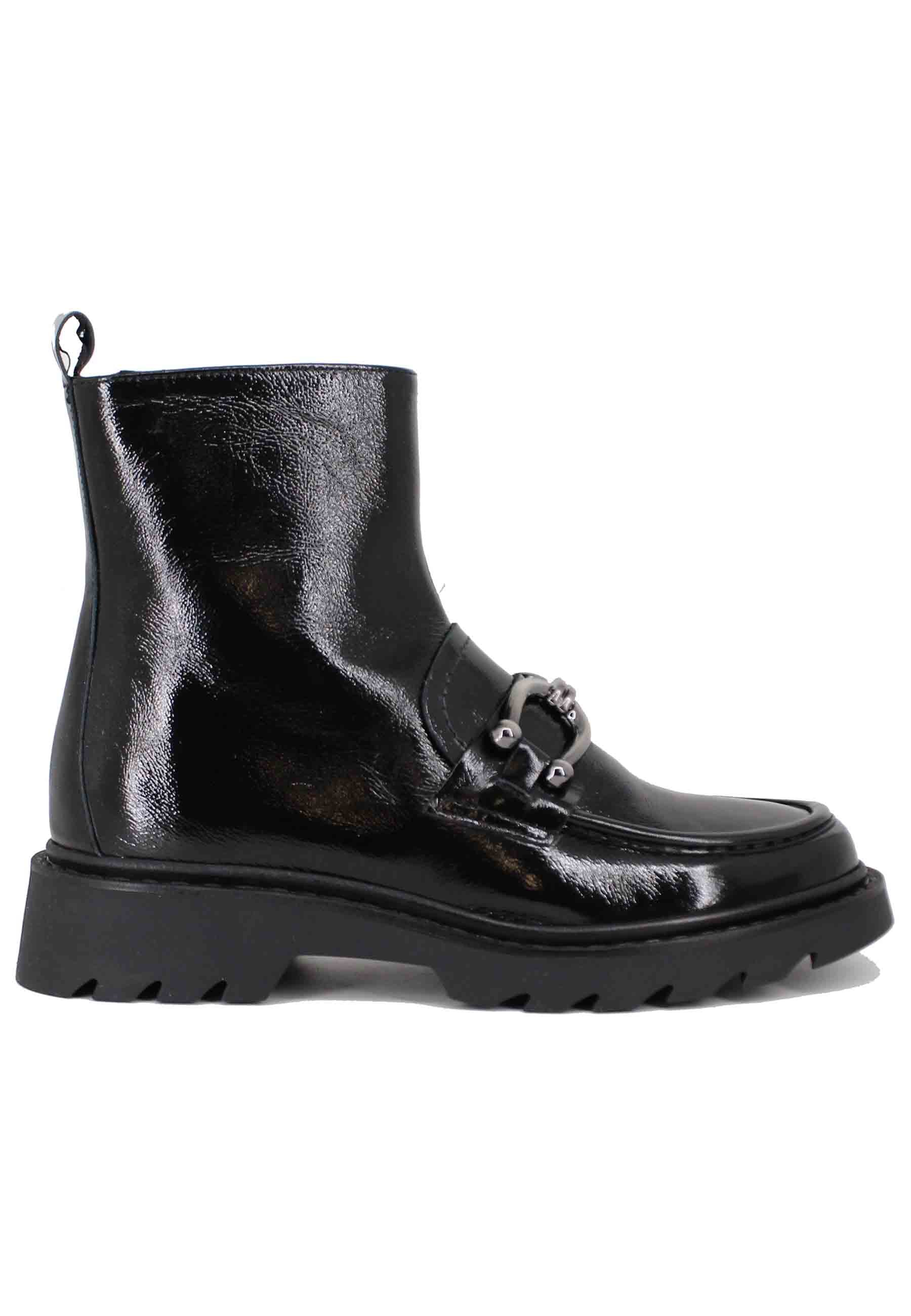 Women's black patent leather ankle boots with lug sole