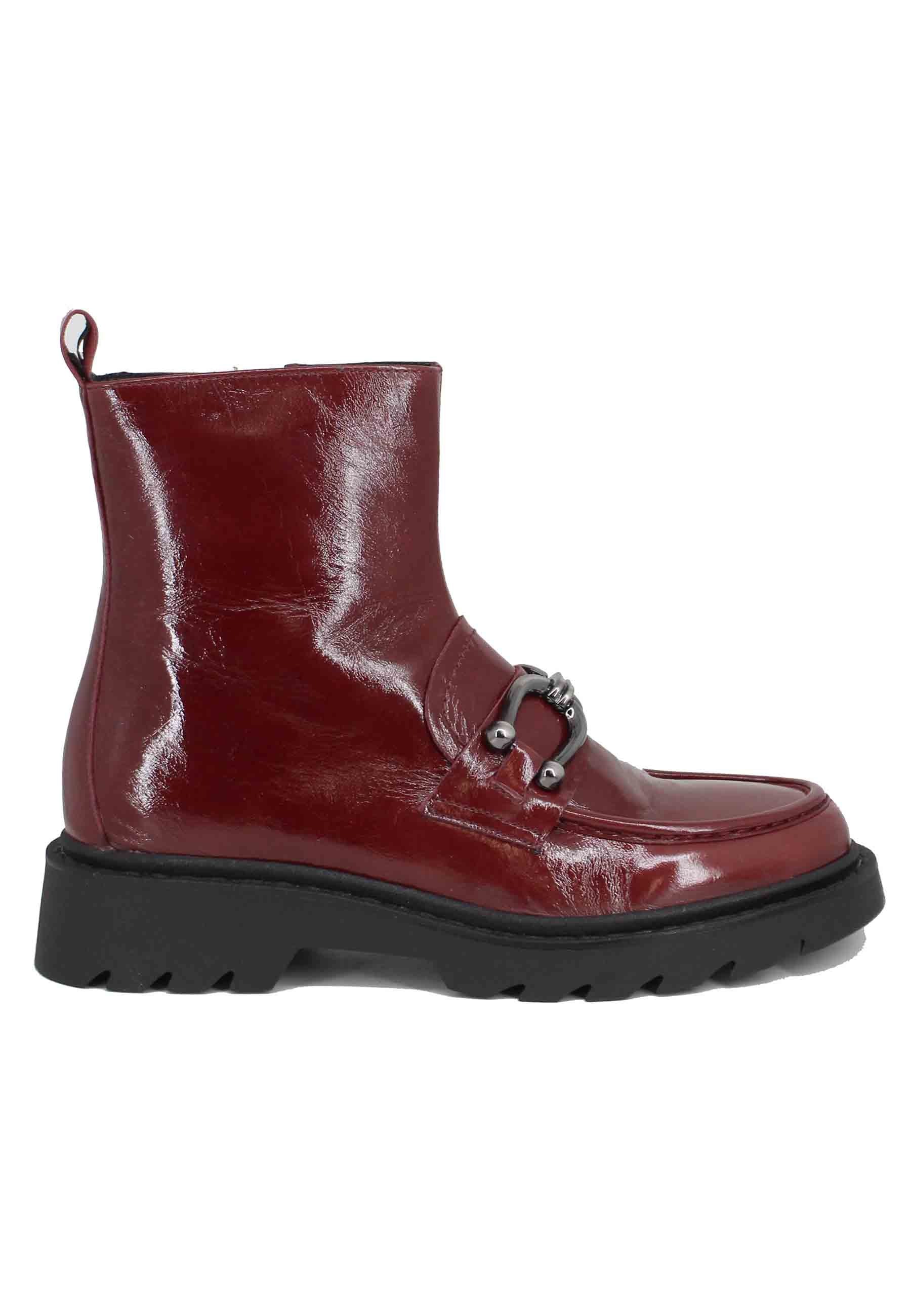 Women's burgundy patent leather ankle boots with lug sole