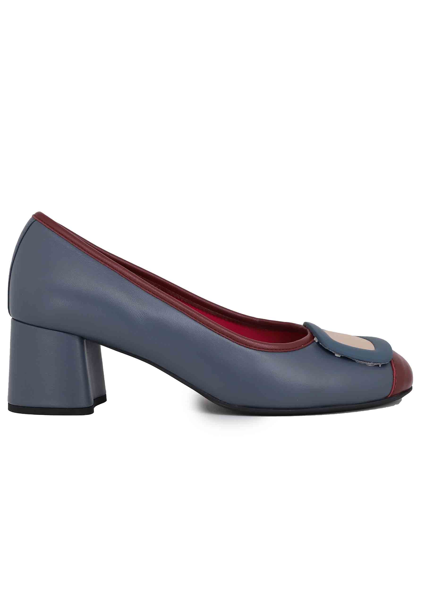 Women's blue leather pumps with accessory and round toe