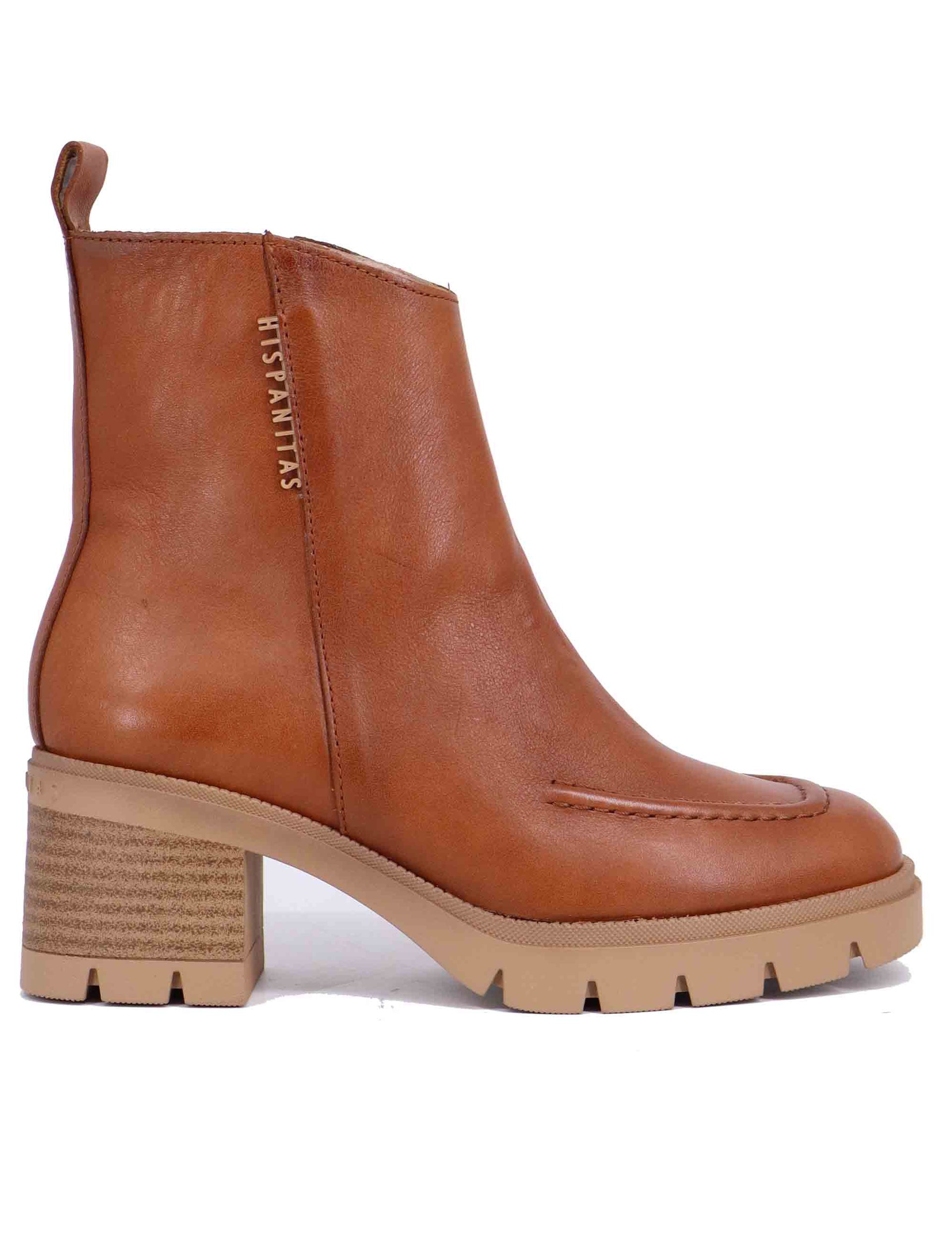 Women's ankle boots in leather with lug sole