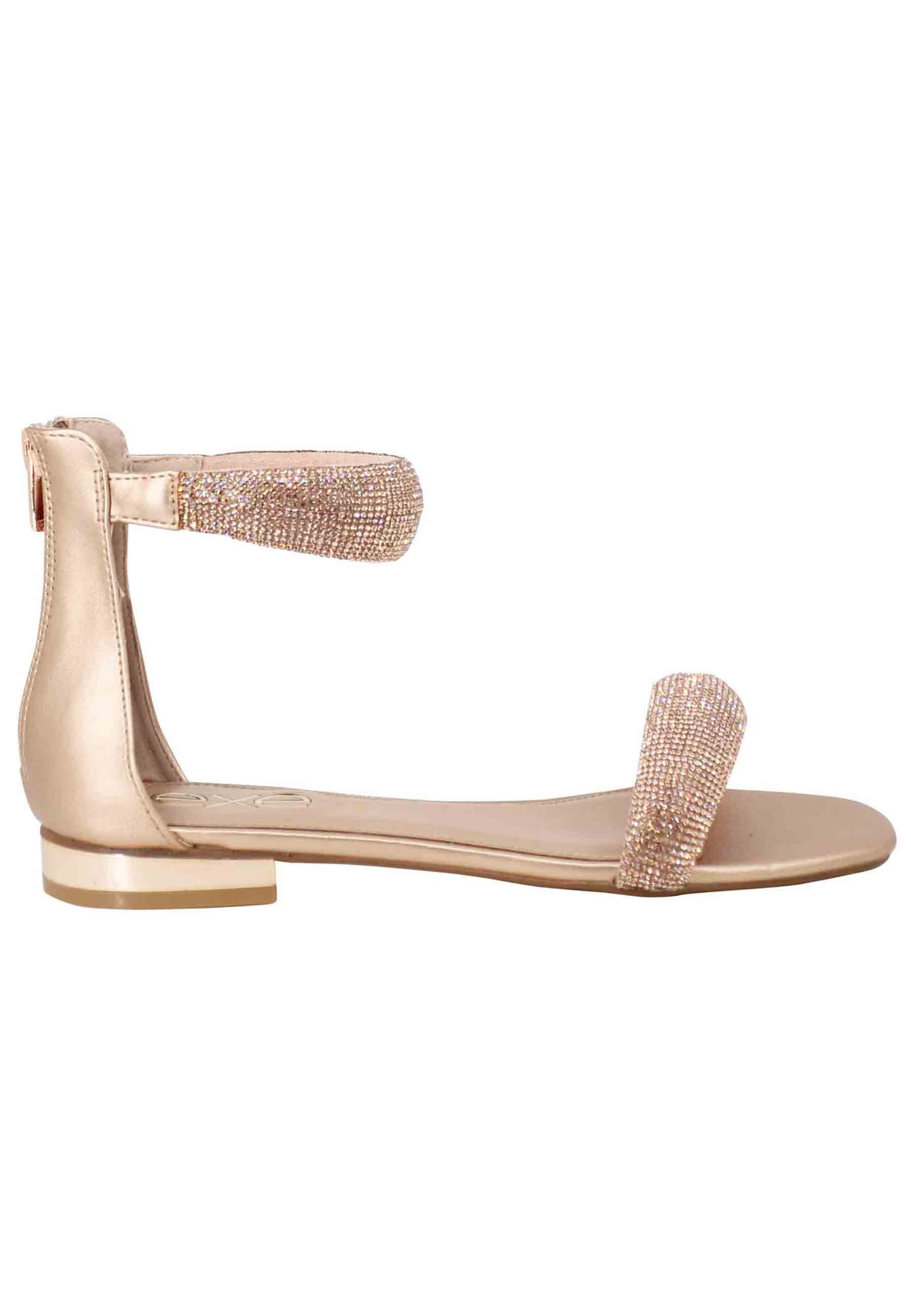 Women's flat sandals in pink rhinestones with low heel and ankle strap