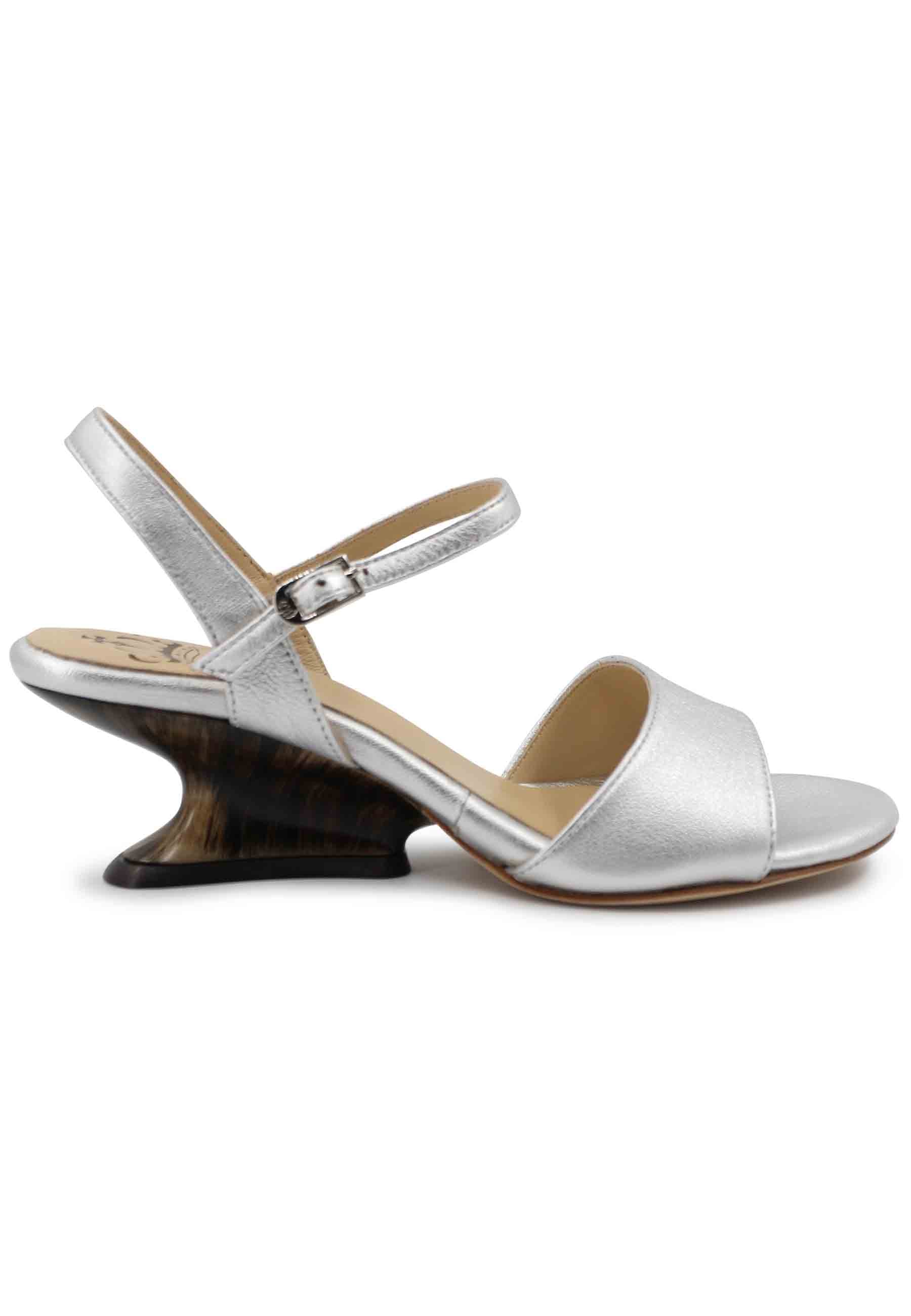 Women's sandals in silver laminated leather with low wedge