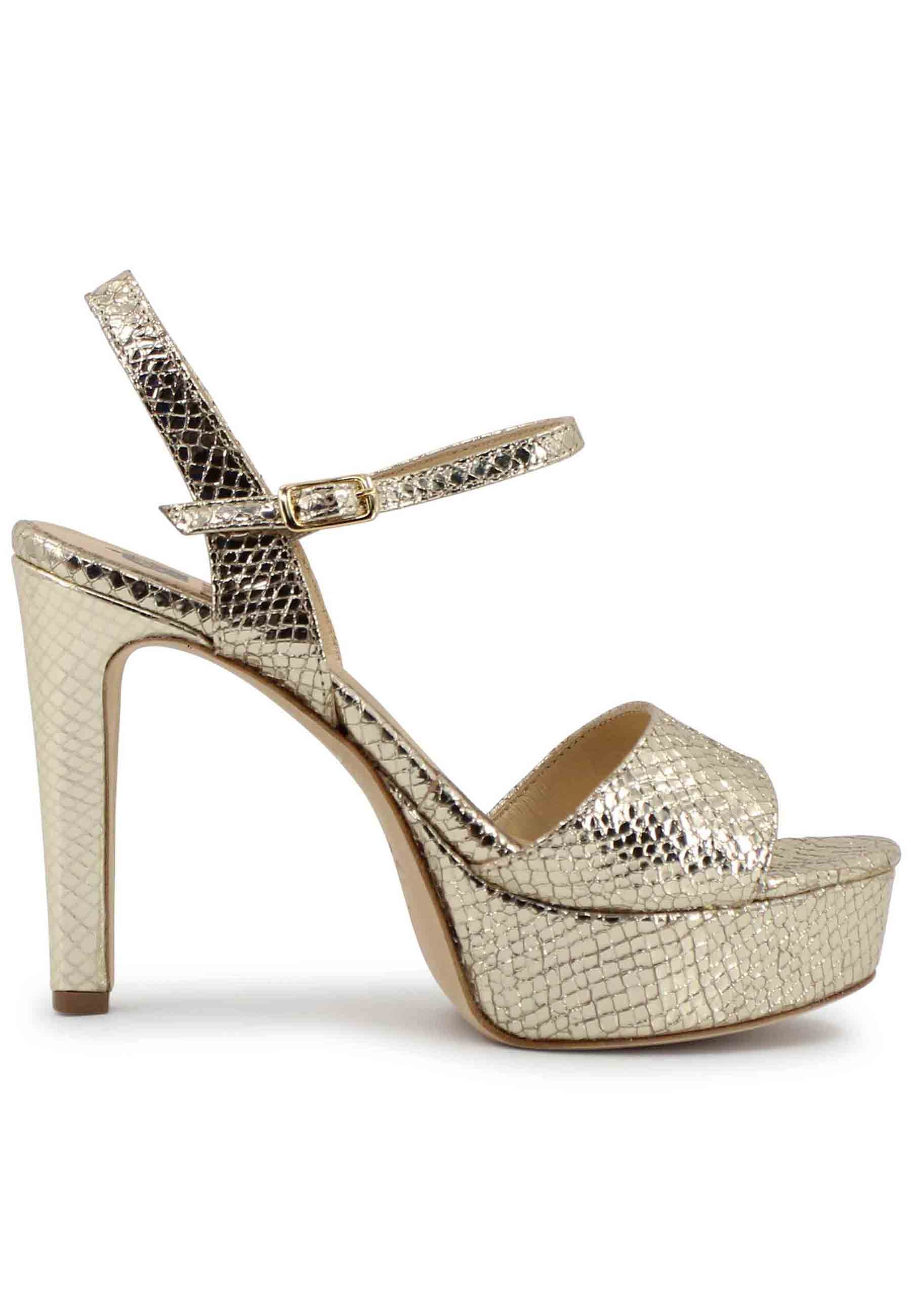 Women's sandals in platinum printed laminated leather with high heel and platform