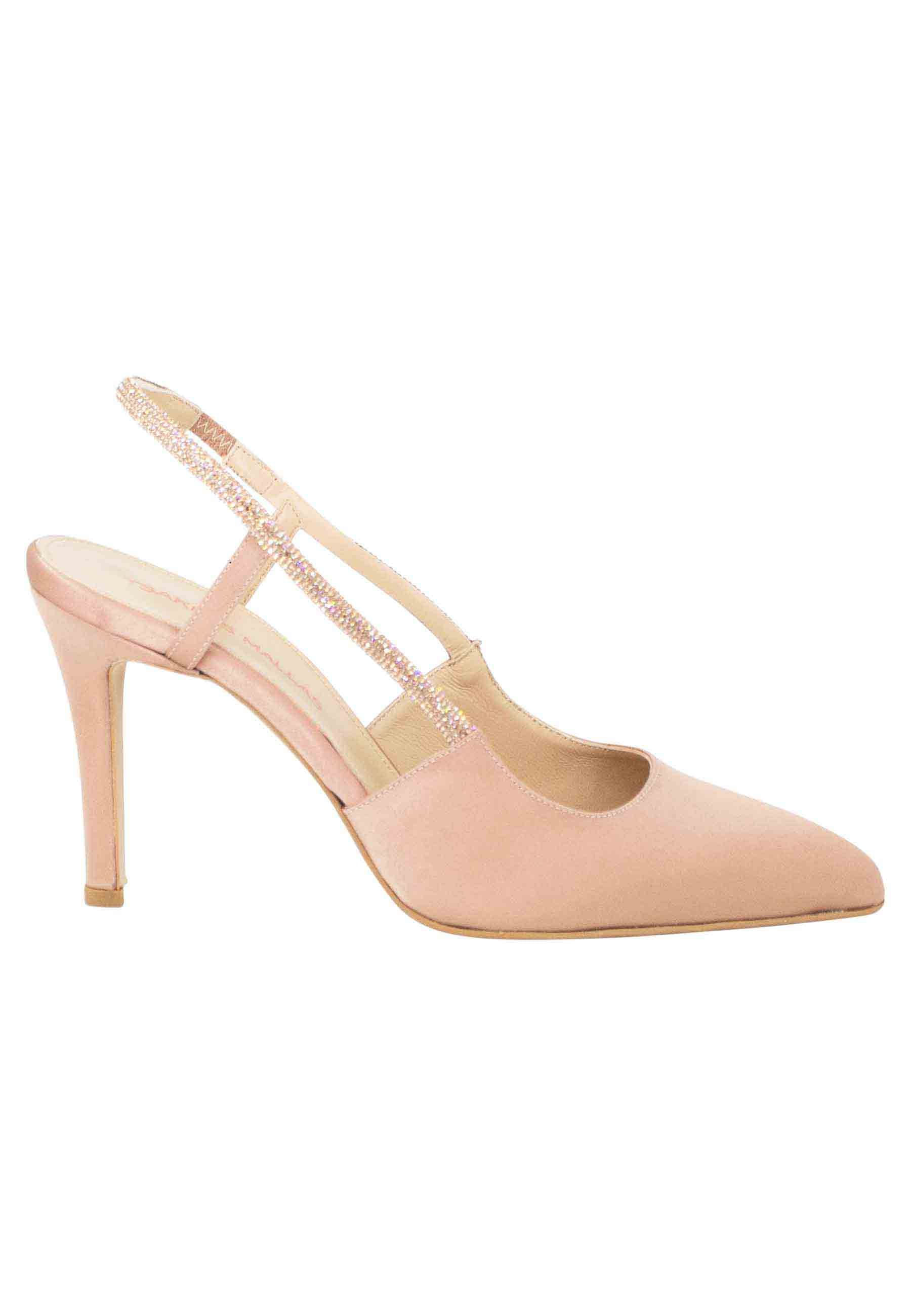 Women's slingback pumps in powder pink fabric with rhinestone strap