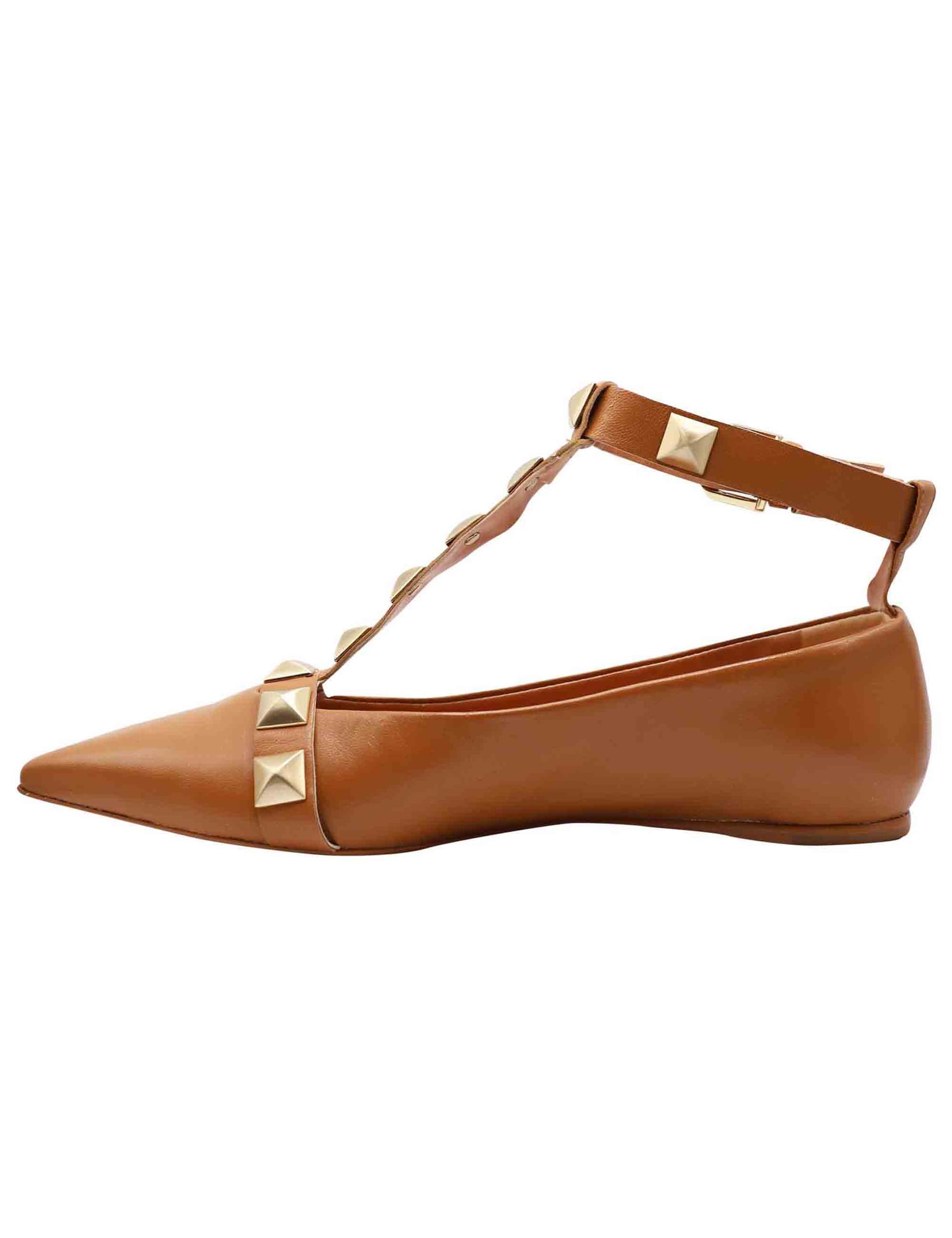Women's tan leather ballet flats with pointed toe straps and studs