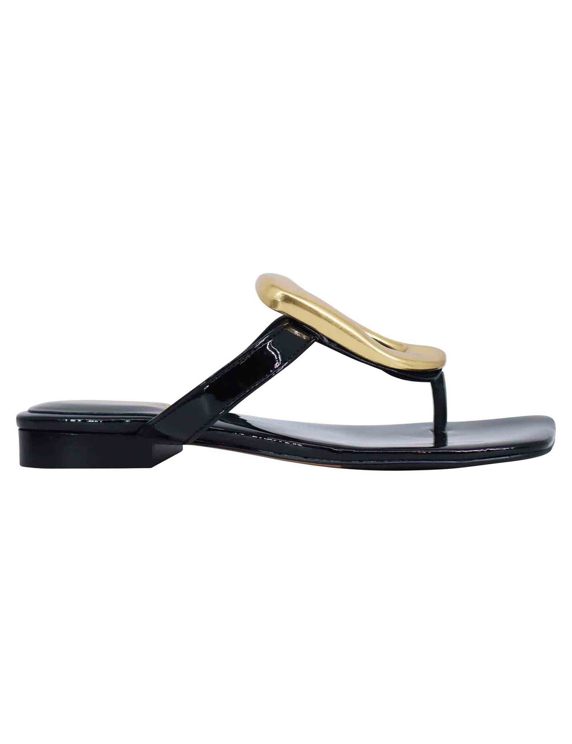 Women's black patent leather thong sandals with low heel and gold accessory