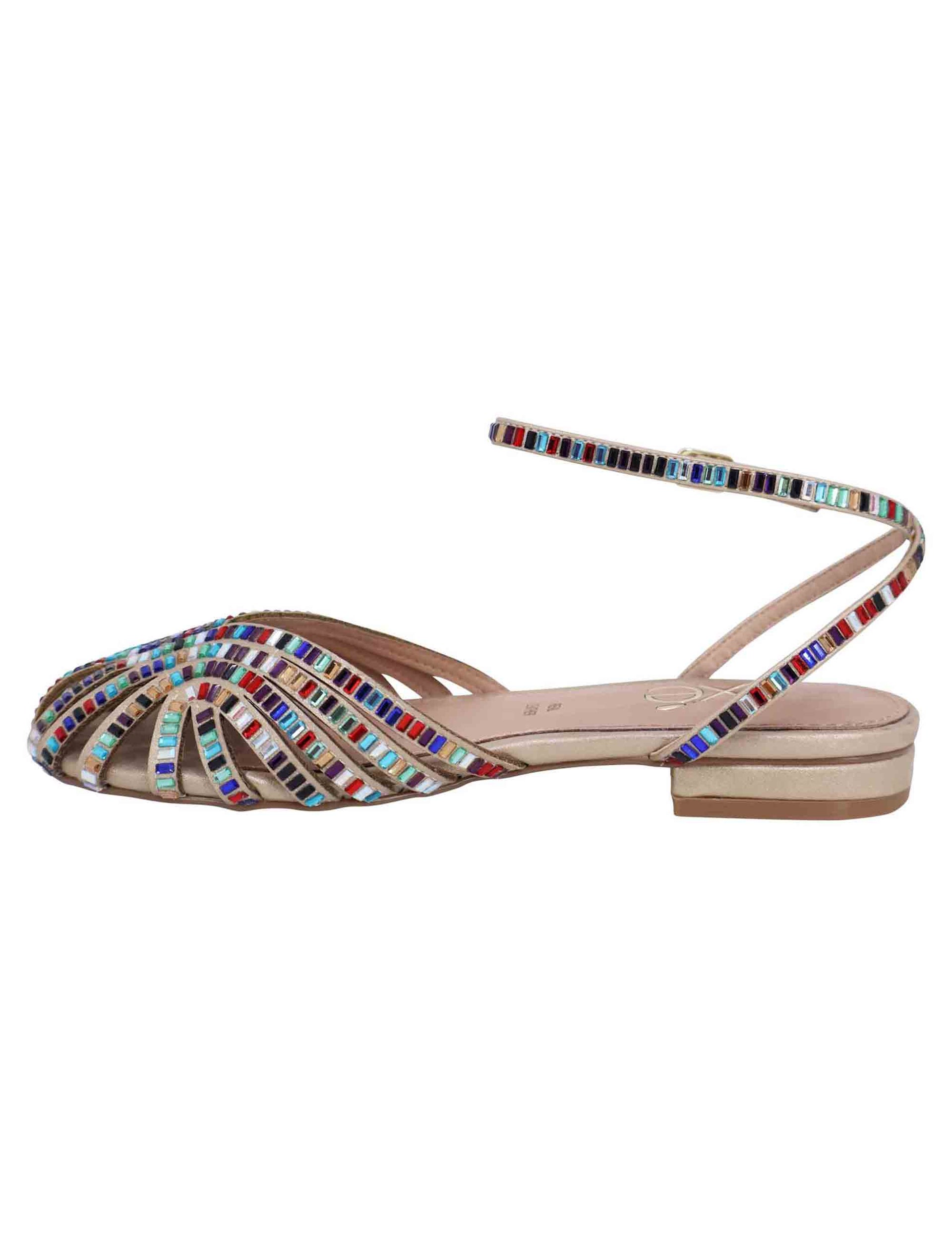 Women's flat sandals in gold fabric with multicolored stones and ankle strap
