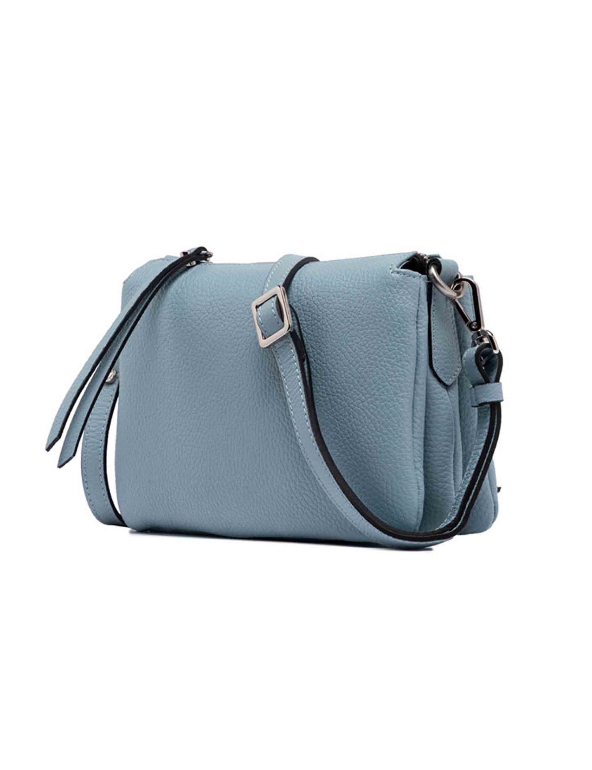 Three women's clutch bags in light blue leather with matching removable shoulder strap