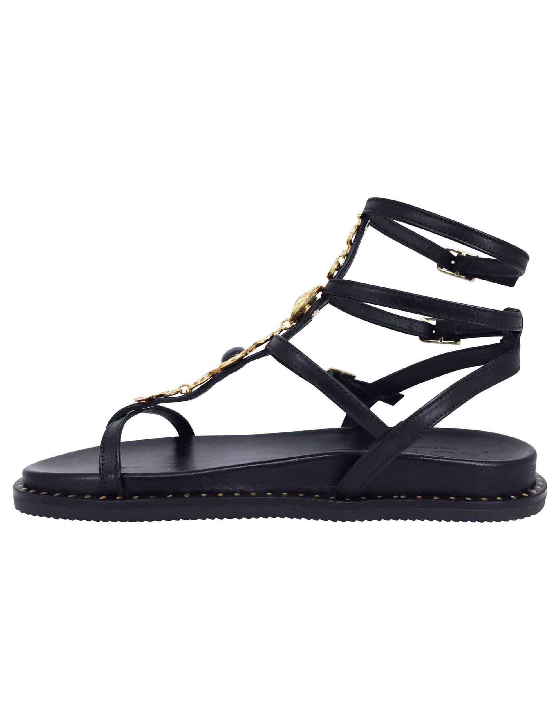 Women's flat flip-flop sandals in black leather with studs and ankle straps