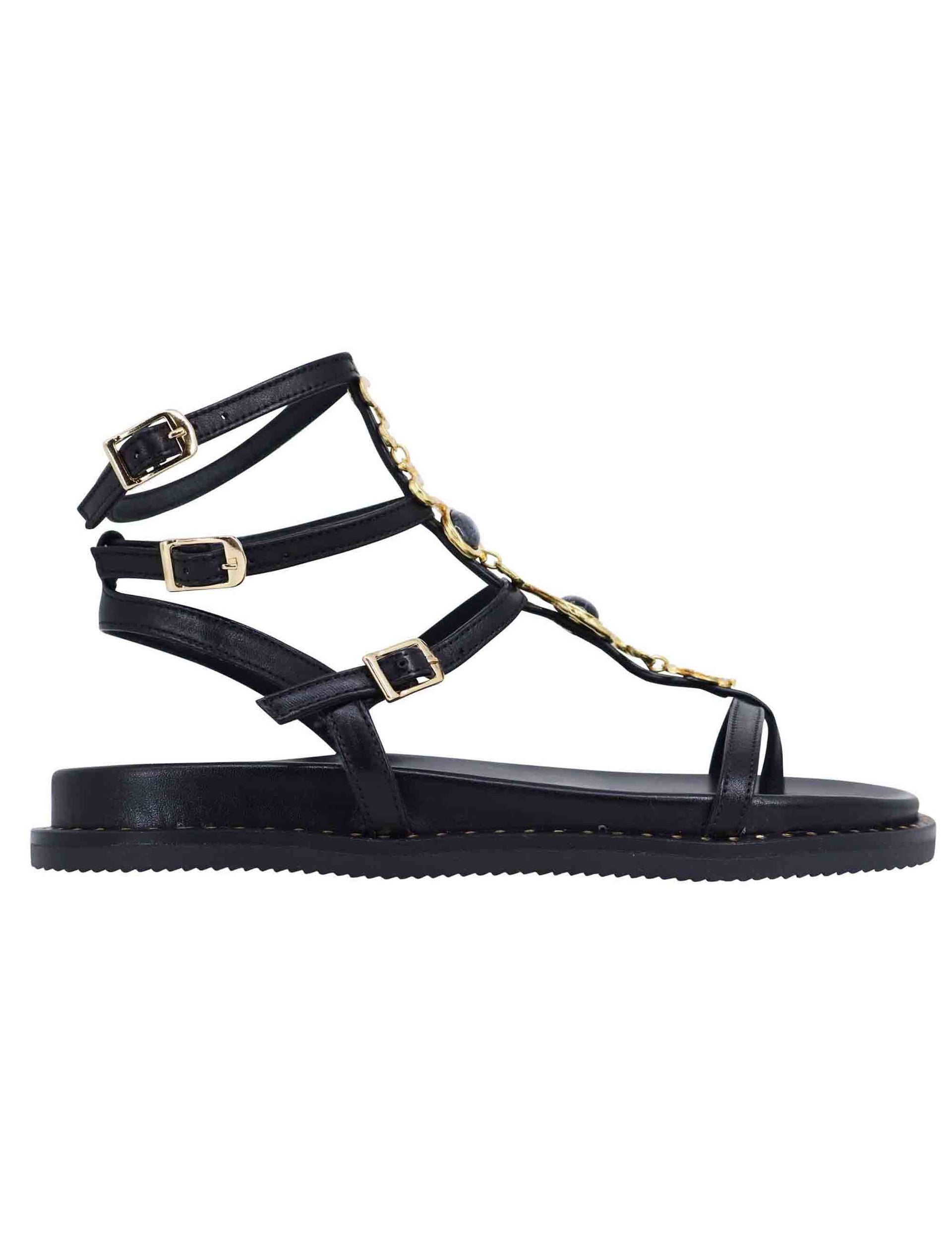Women's flat flip-flop sandals in black leather with studs and ankle straps