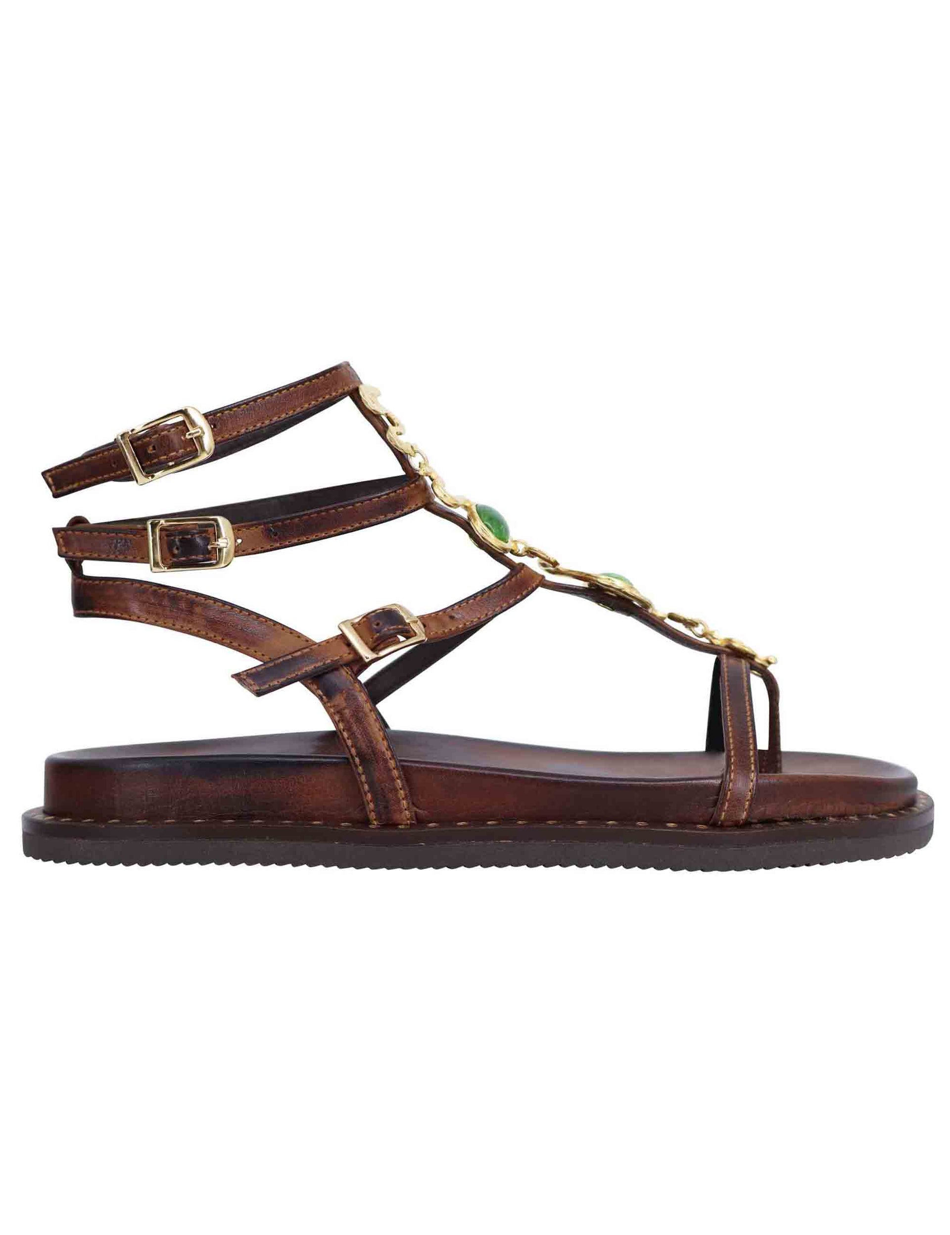 Women's flat flip-flop sandals in brown leather with studs and ankle straps