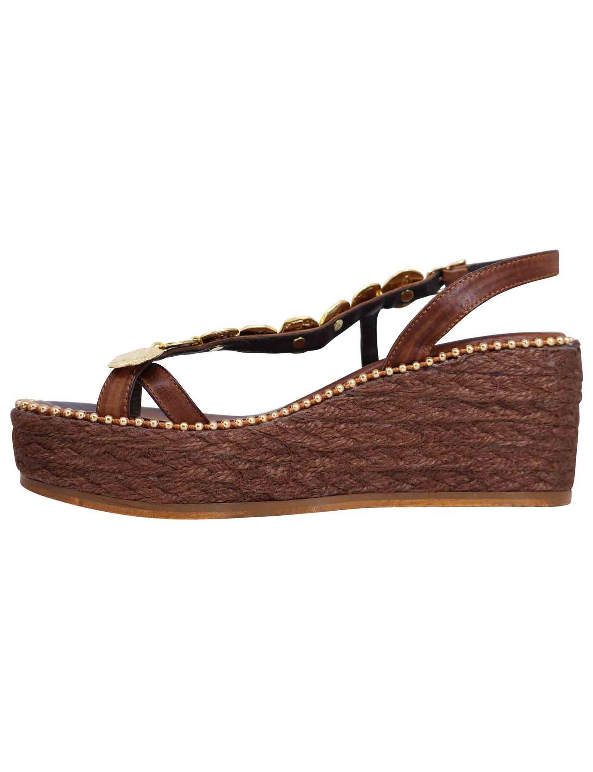 Women's flip-flop sandals in dark brown leather with gold accessories and rope wedge