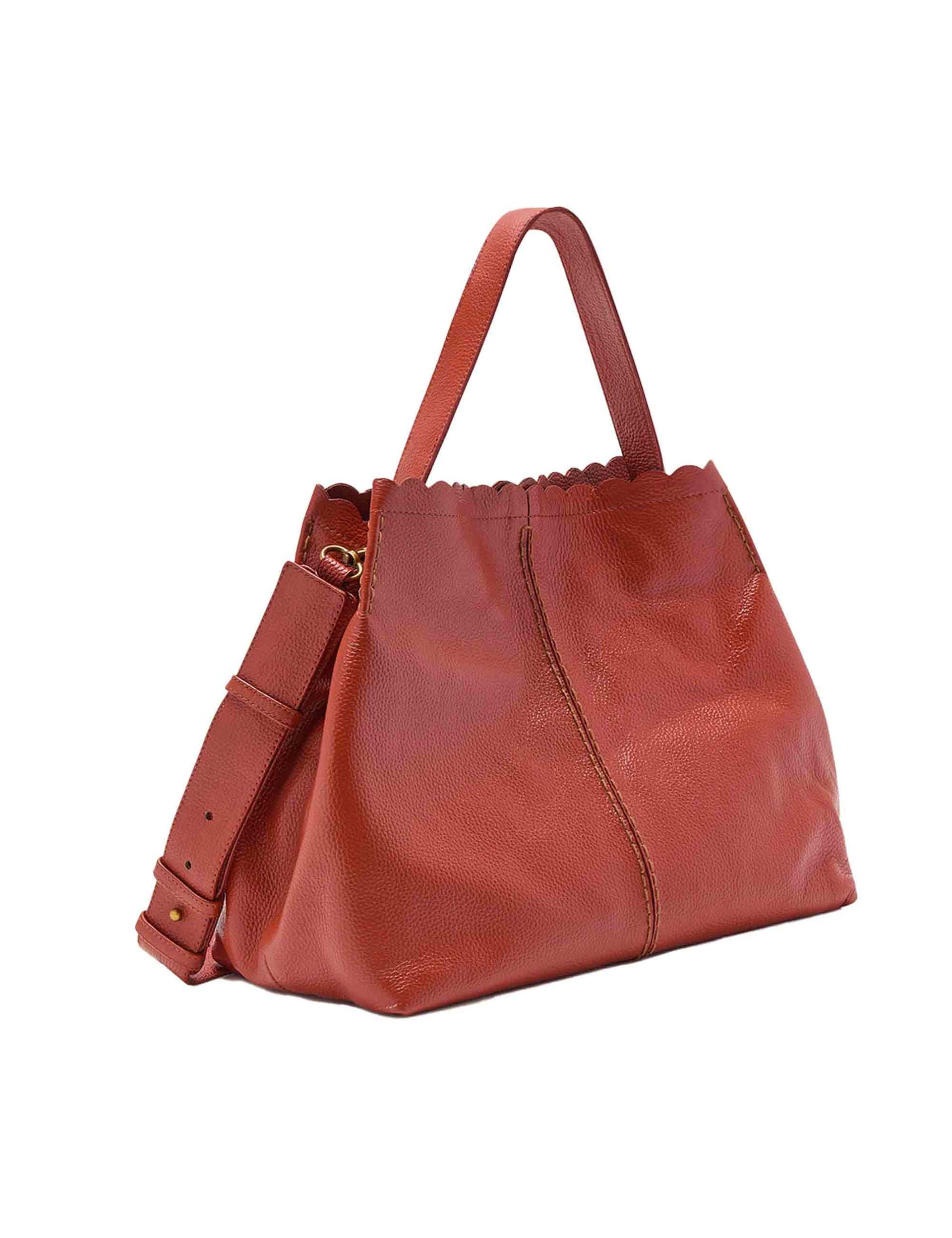 Text Tured women's shoulder bags in tan leather
