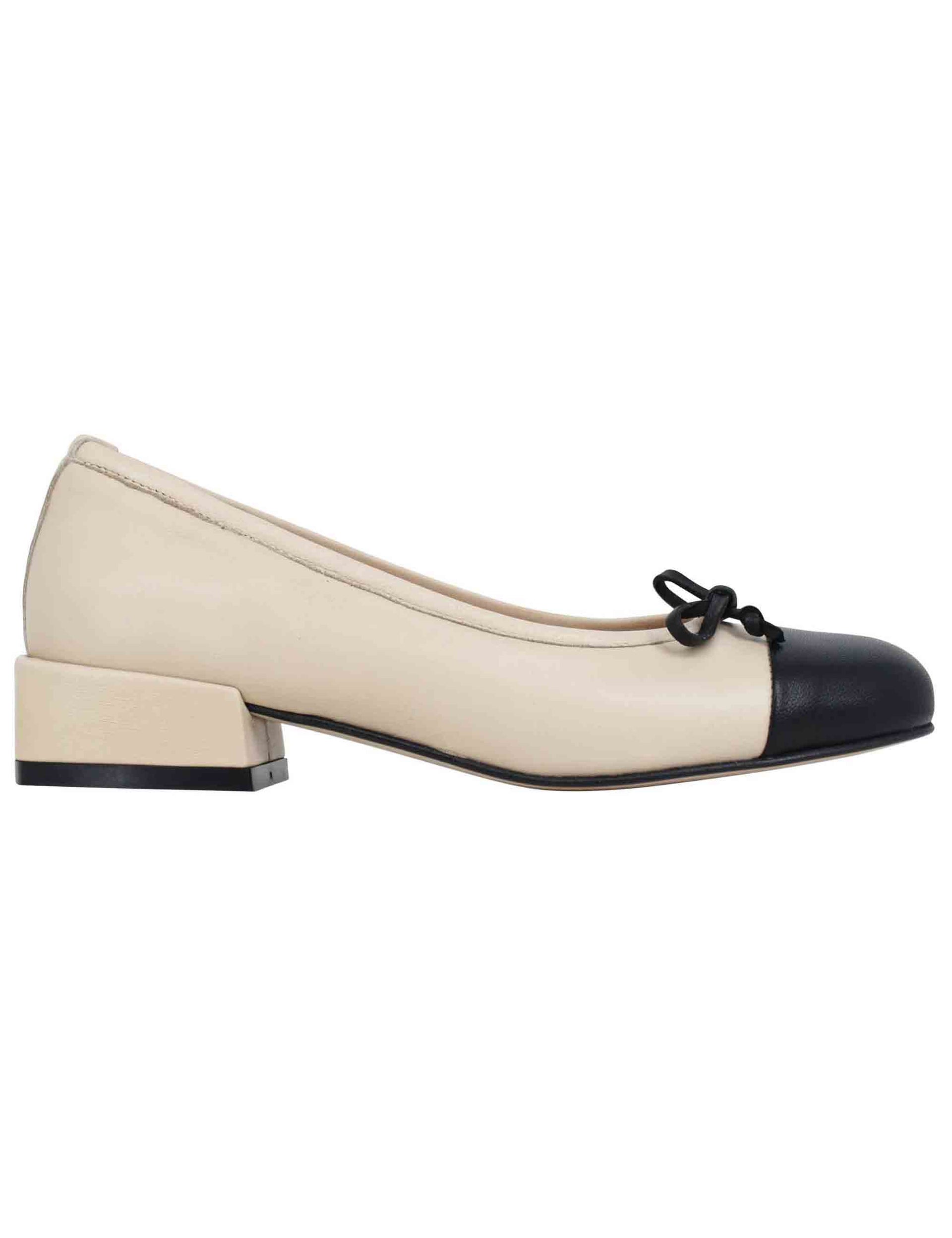 Women's beige leather ballet flats with black toe cap and bow