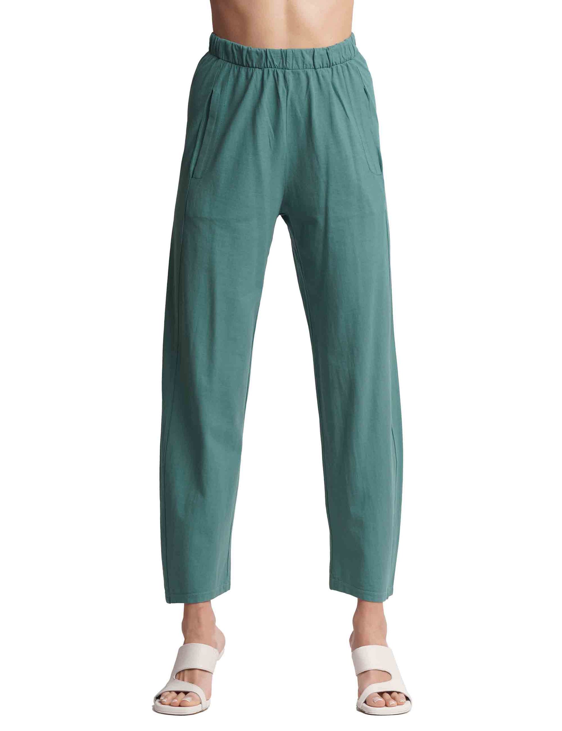 Women's green cotton trousers with elastic waist and French pockets