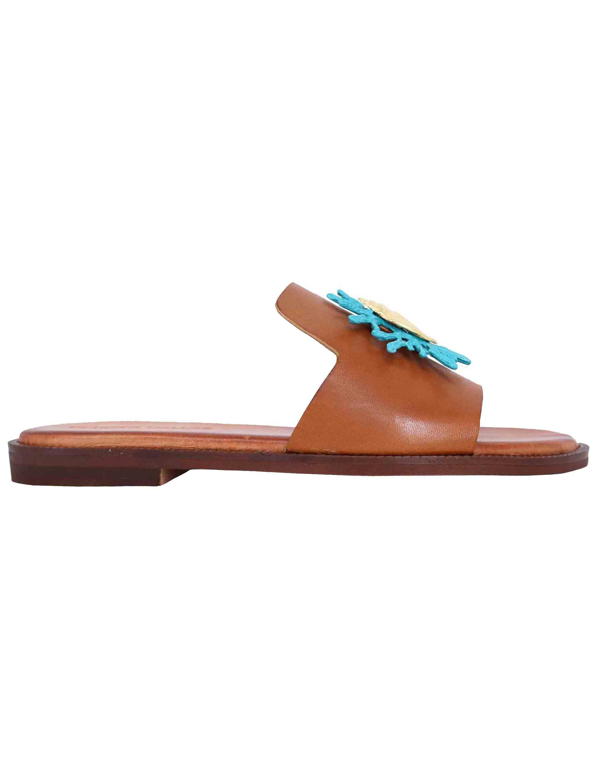 Women's flat sandals in tan leather with turquoise accessory