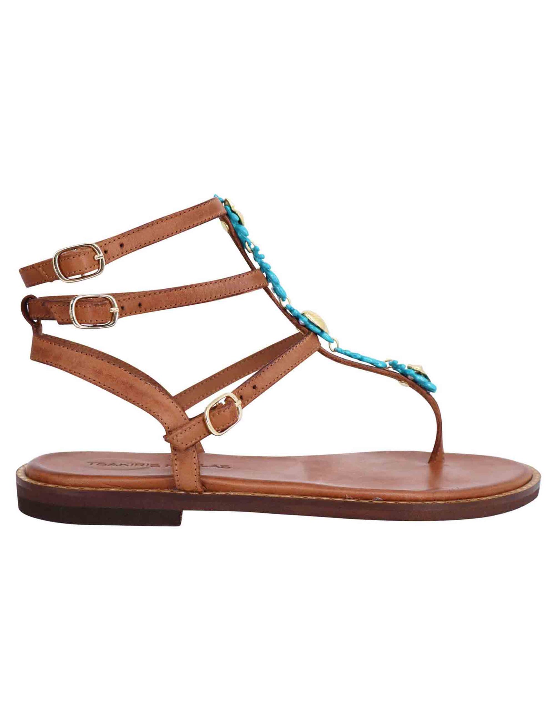 Women's flat sandals in tan leather with turquoise accessory and ankle straps