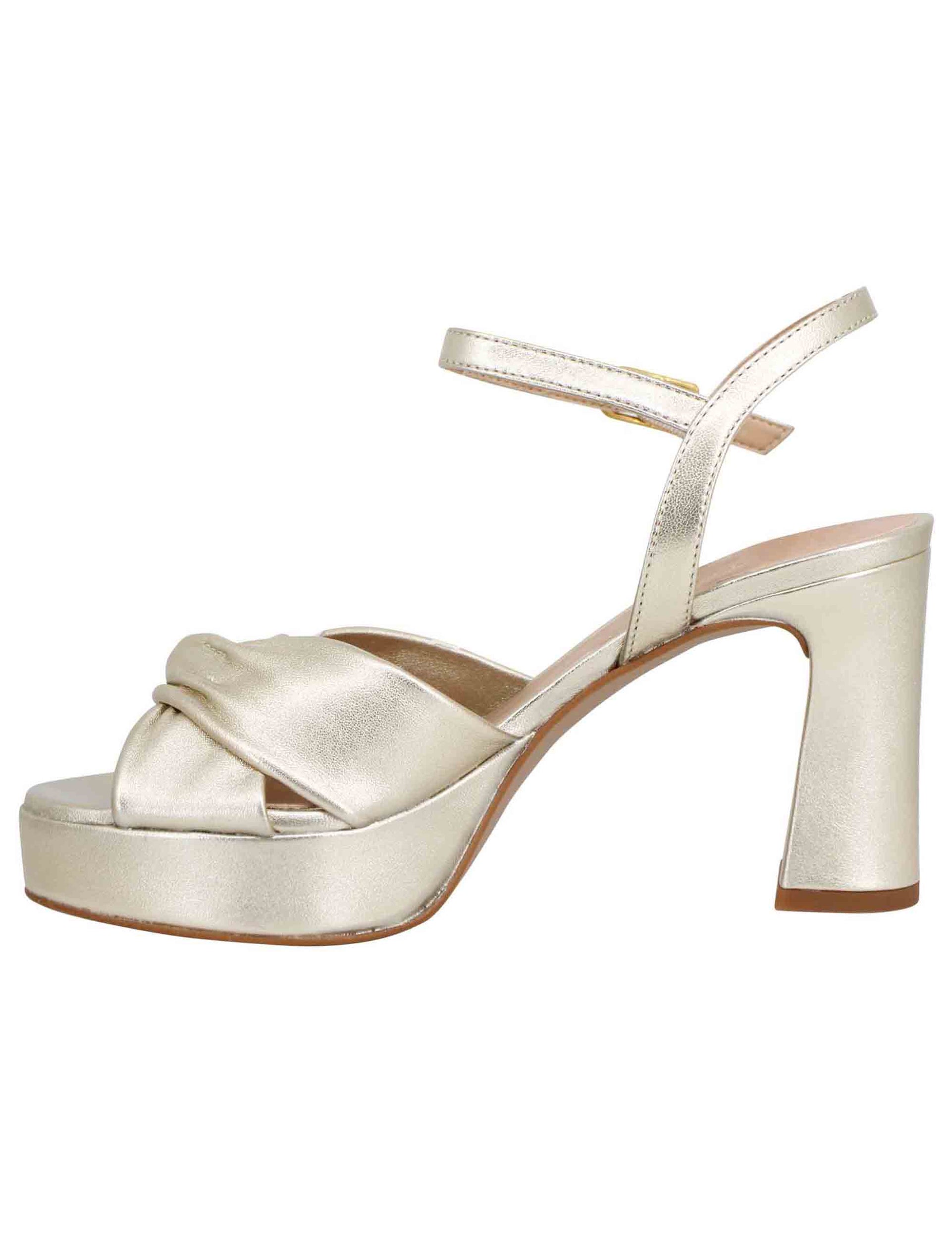 Women's sandals in platinum laminated leather with high heel and platform