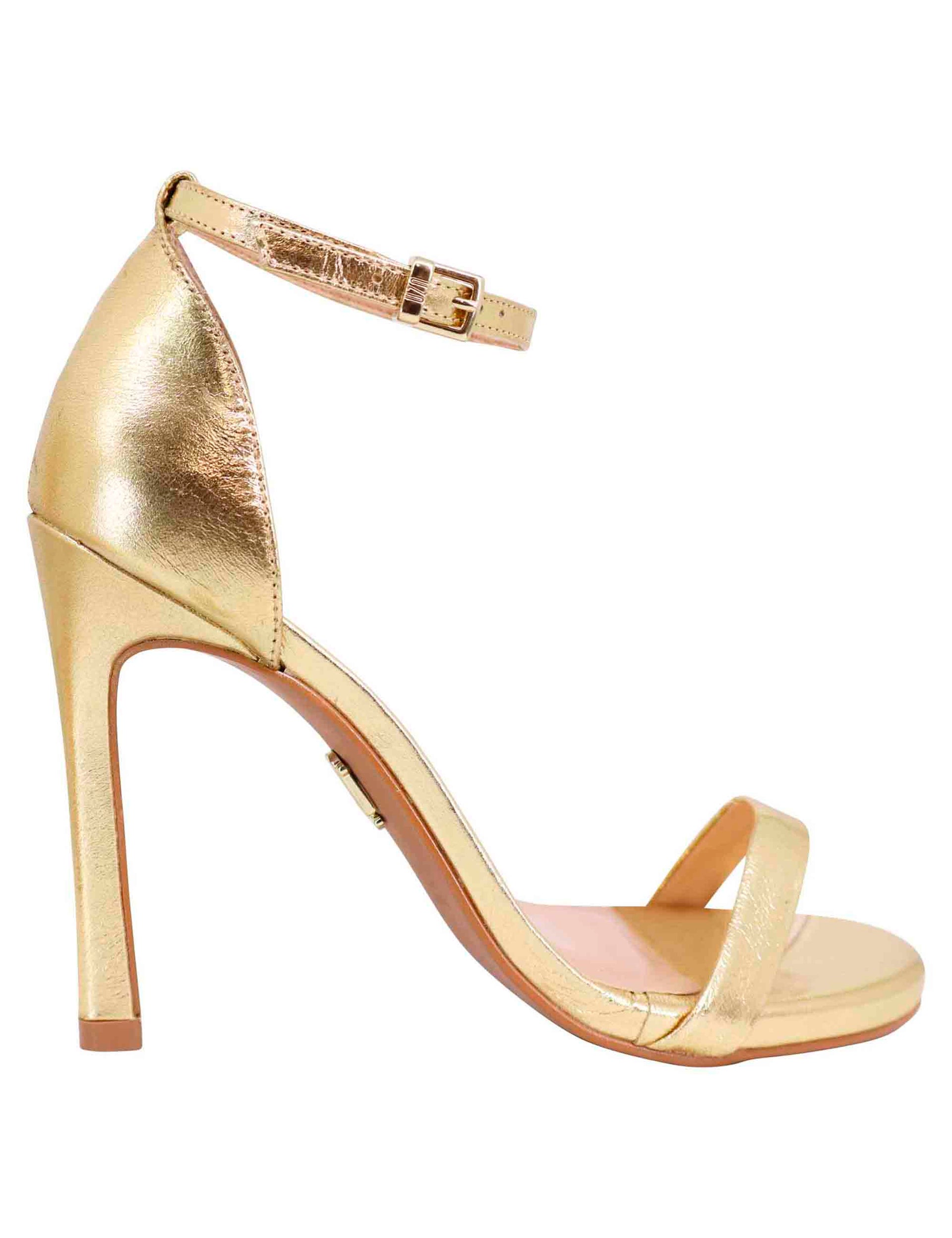 Women's sandals in gold leather with high heel and ankle strap