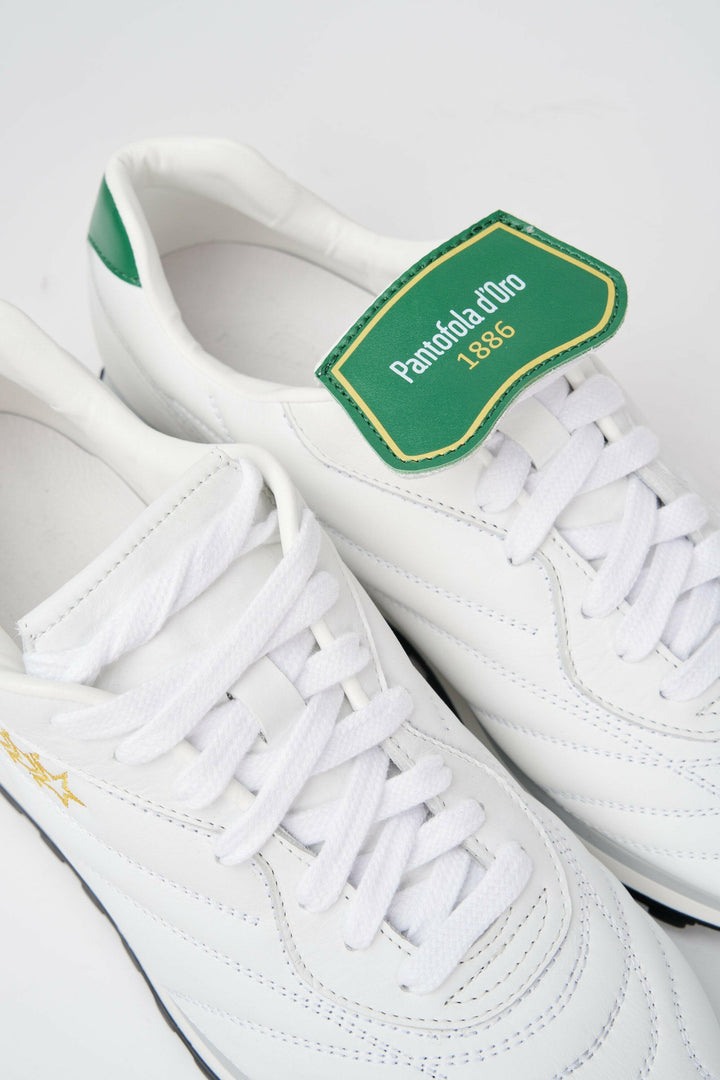 Sneakers uomo Pitch in pelle bianca e verde con stelle cucite oro.